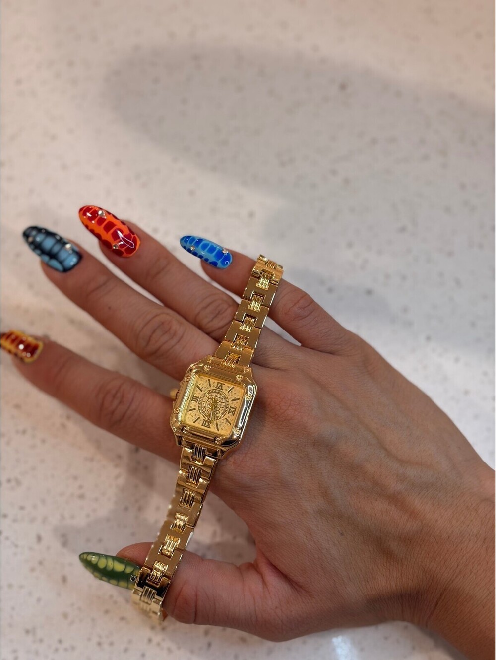Elegant Gold Tone Wristwatch with Roman Numerals
